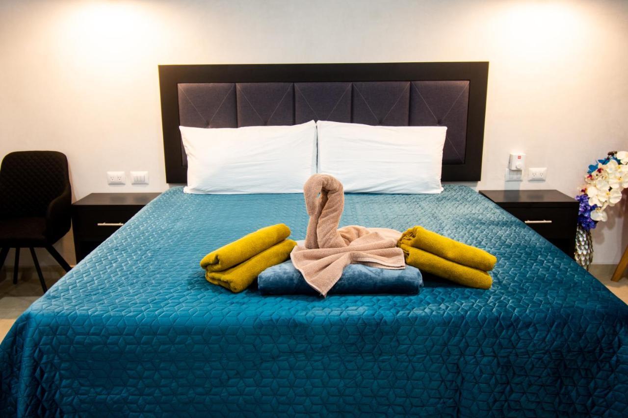 Hotel Casa Tortuga Tulum - Cenotes Park Inclusive 外观 照片 A bed with a towel swan